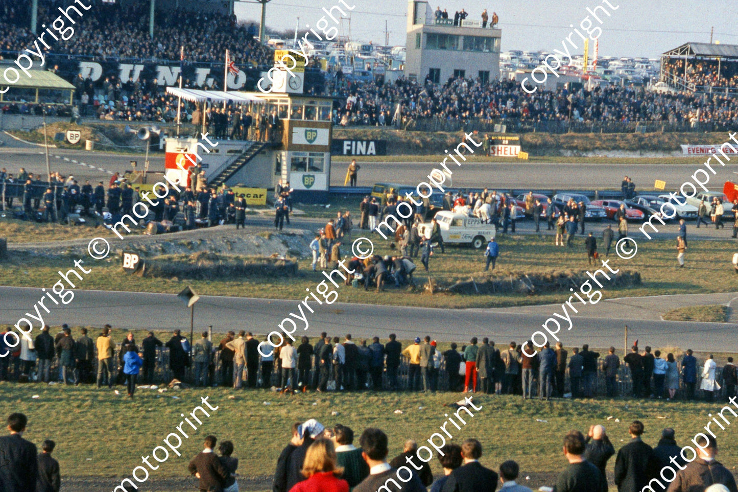 1965 a4 5 Jim Clark (in blue below BP sign) Lotus 33 heat 2 off (courtesy Roger Swan) ed 018
