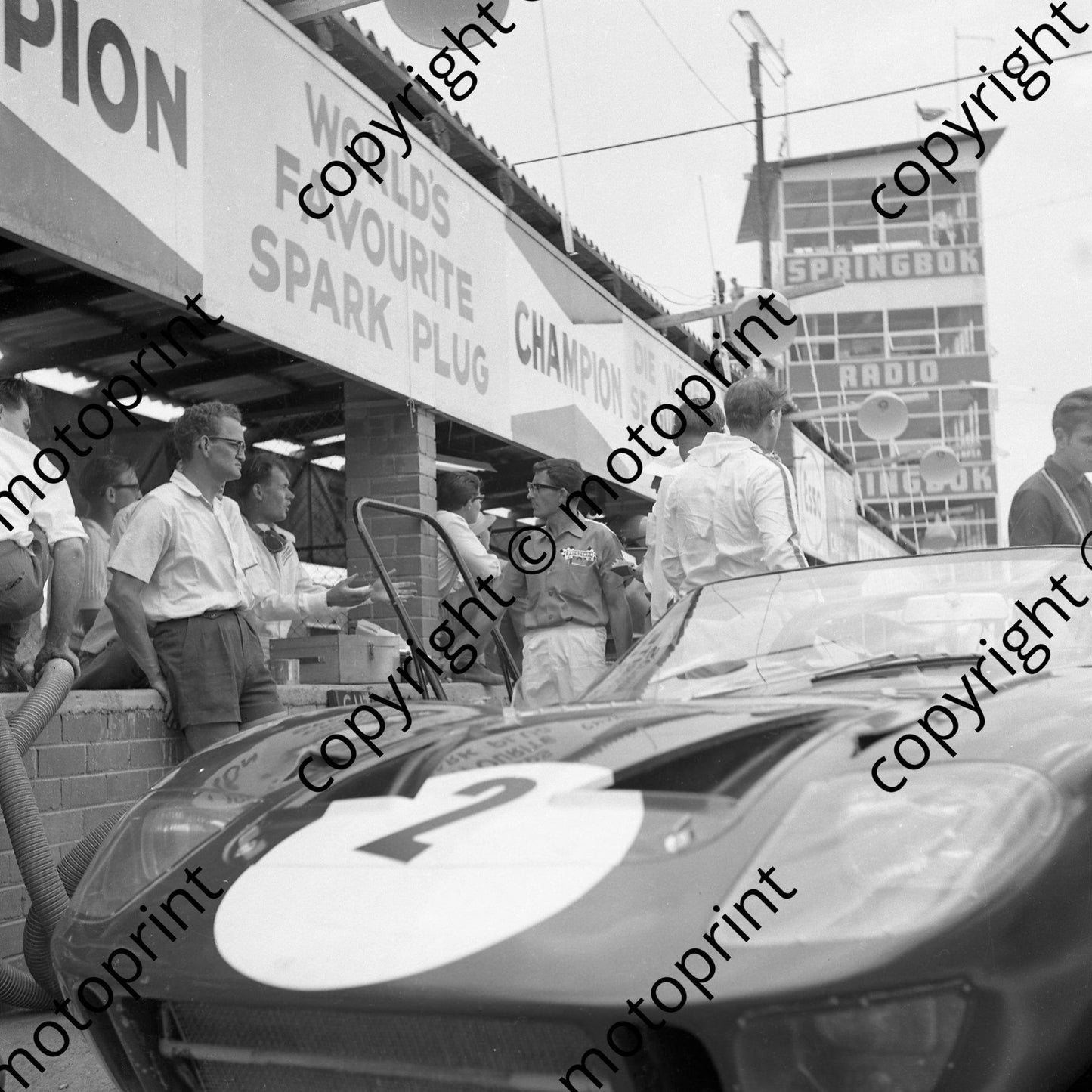 1966 2 Peter Sutcliffe, irate John Love telling Firestone's man what he thinks of the handling of Ford P40 (courtesy Ken Stewart) (2)