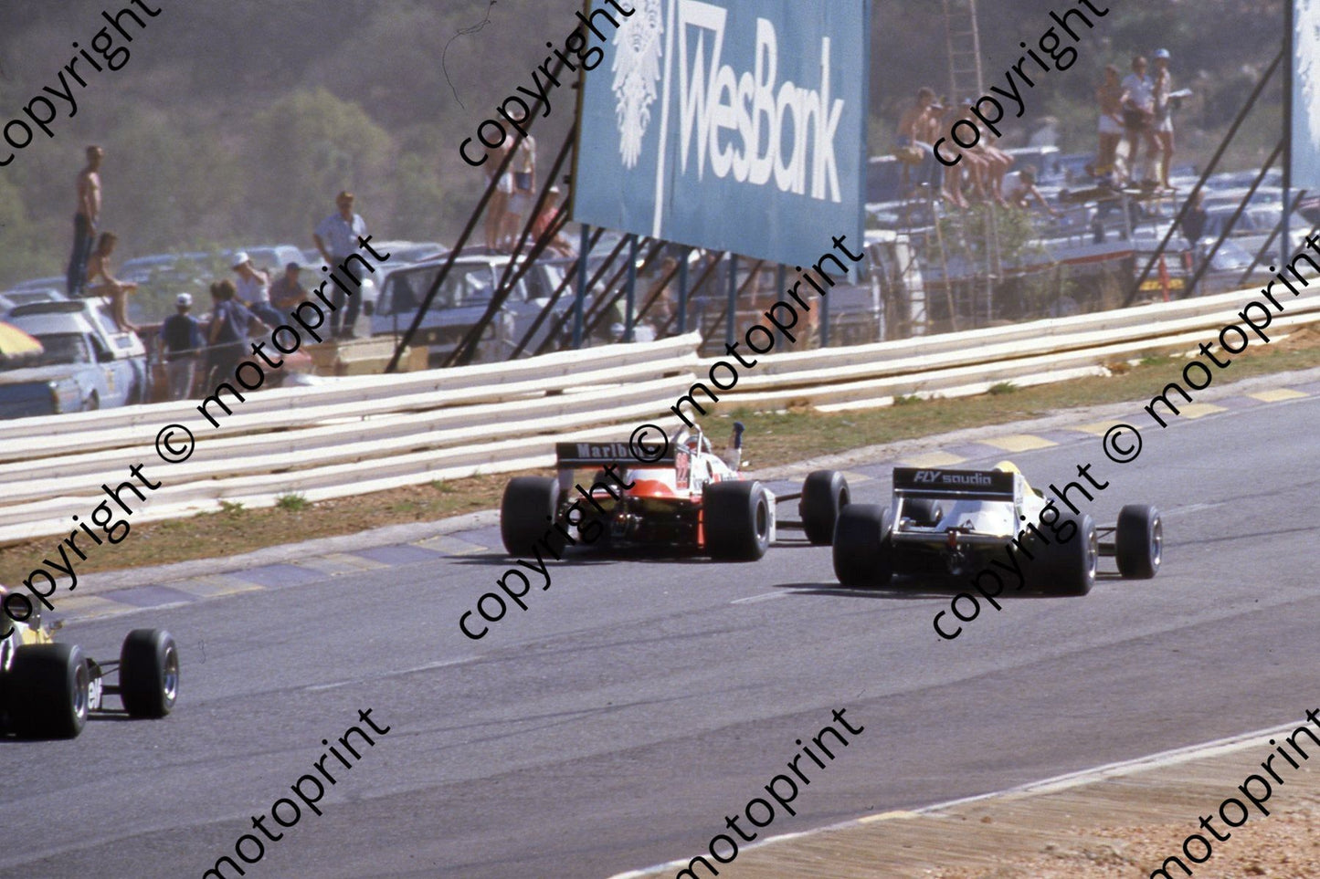 1983 SS SA GP 22 Andrea de Cesaris Alfa waving, Williams FW09 alongside (Courtesy Roger Swan)