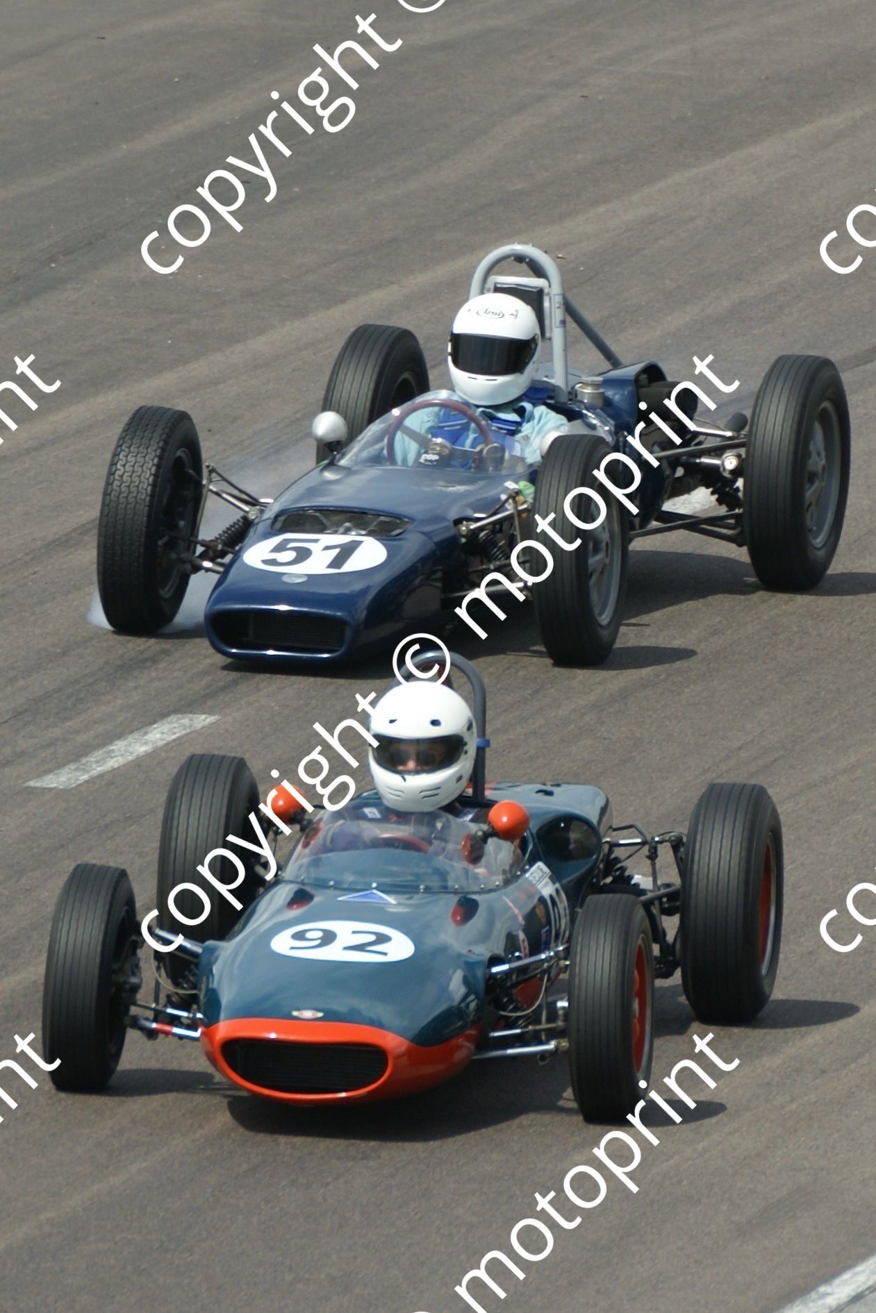 Drake Elva number 51 about to lose left rear wheel, hairpin race 2 31-1 DSC06223