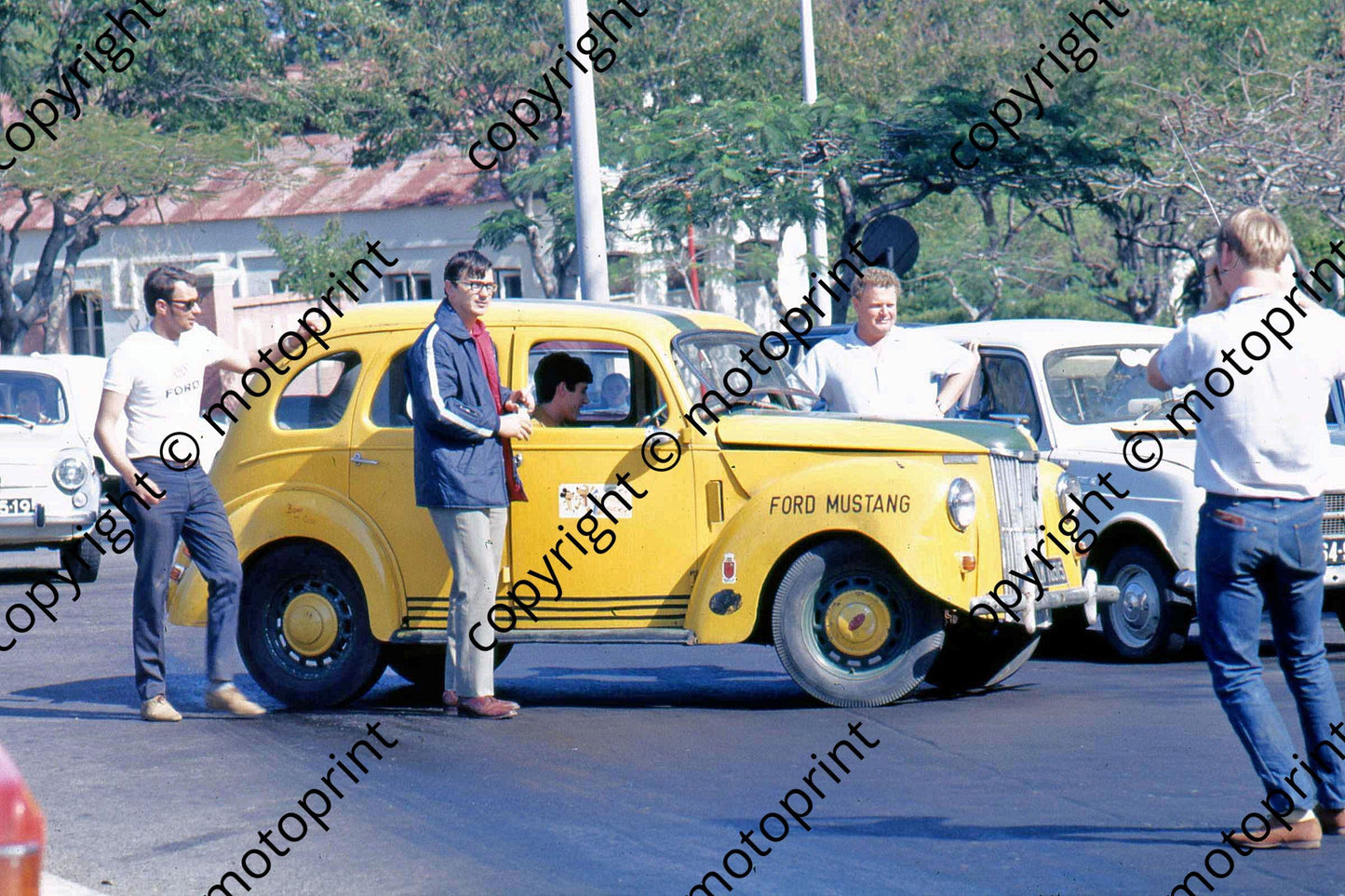 P Bernie Marriner and Rubin Els posing with Ford _Mustang_