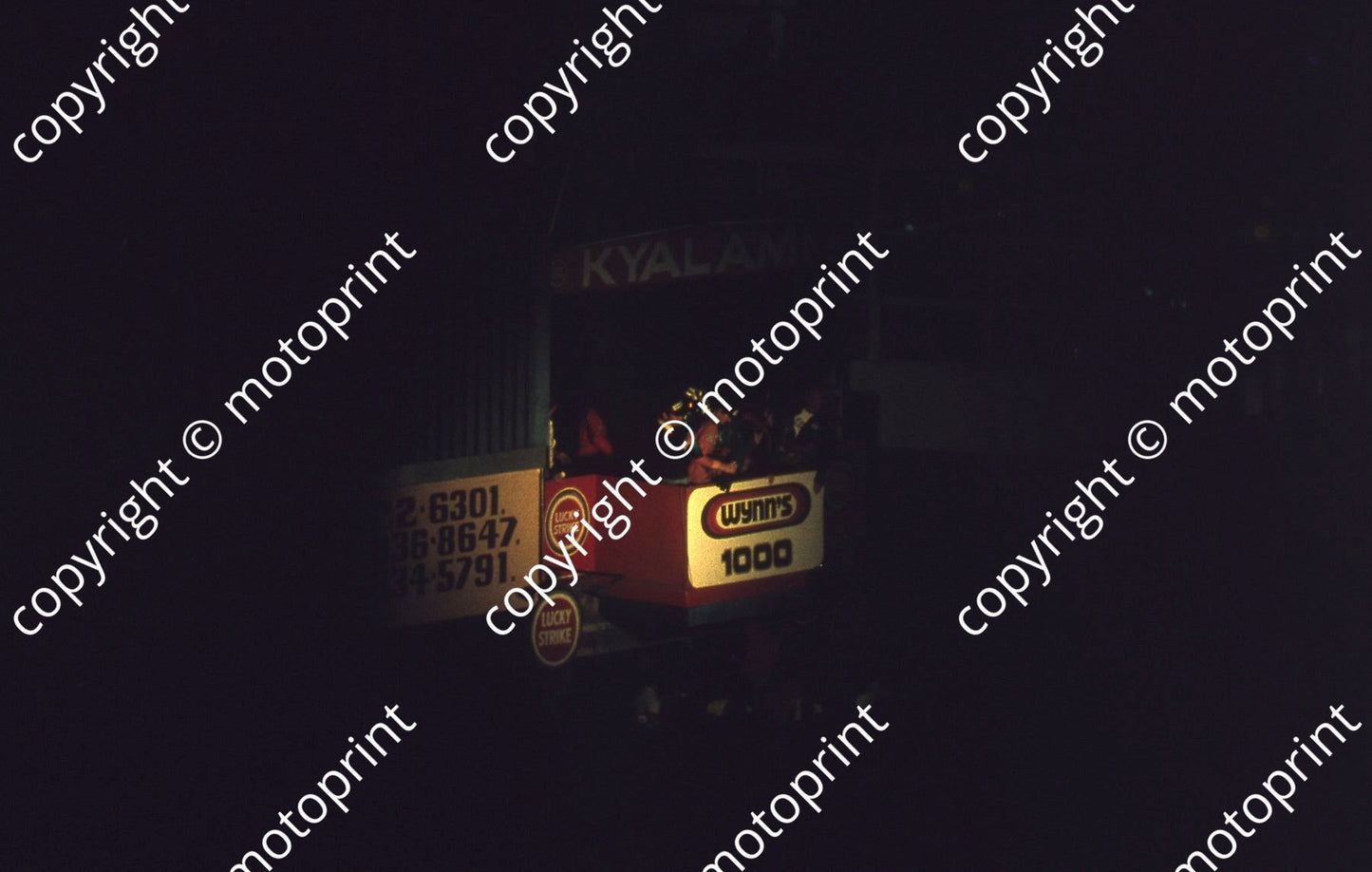 SL (thanks to Stuart Falconer) a 600 1977 Wynns 1000 rostrum Heyer red overalls J Scheckter blue jersey and cap no edit (2)