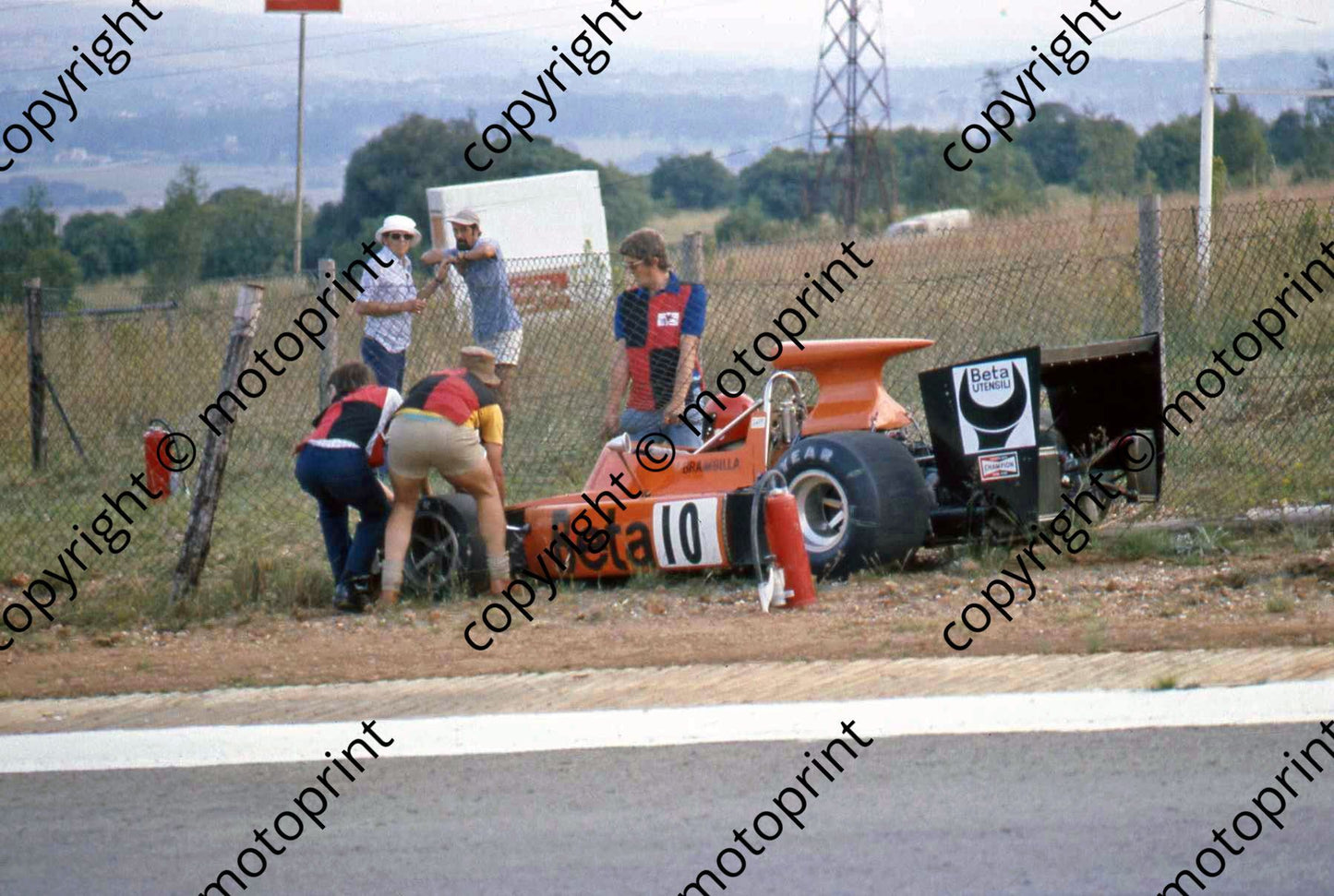 SS Brambilla March 741 being hepled from the fences