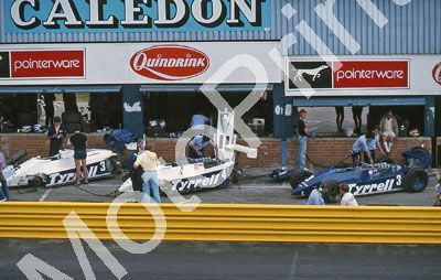 (thanks Stuart Falconer) a 796 1982 SA GP Tyrrell 011 pits #3 white and blue cars Alboreto; #4 white Borgudd
