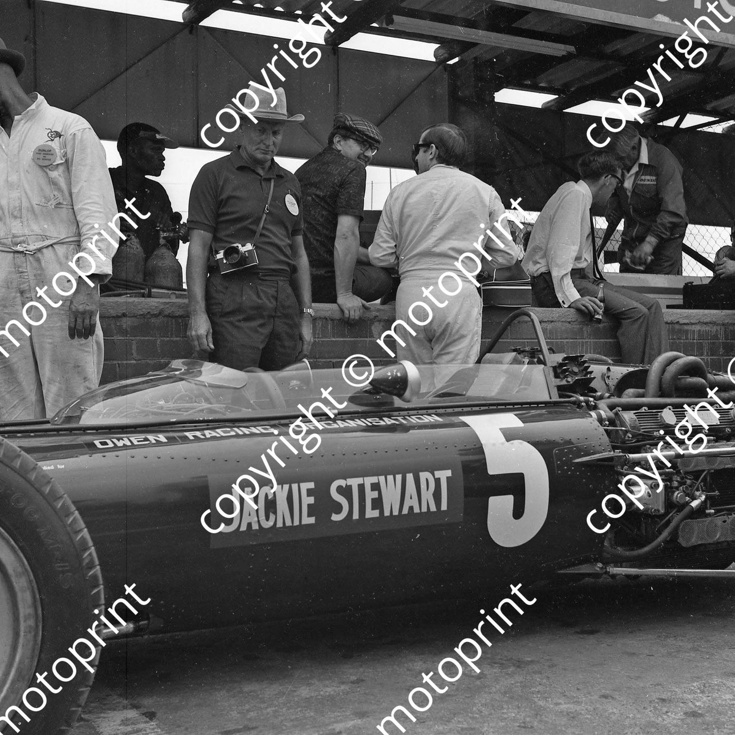 1967 SA GP BRM P53 H16 Jackie Stewart car, Tony Rudd Jackie Stewart conversation behind car (courtesy Ken Stewart) 108