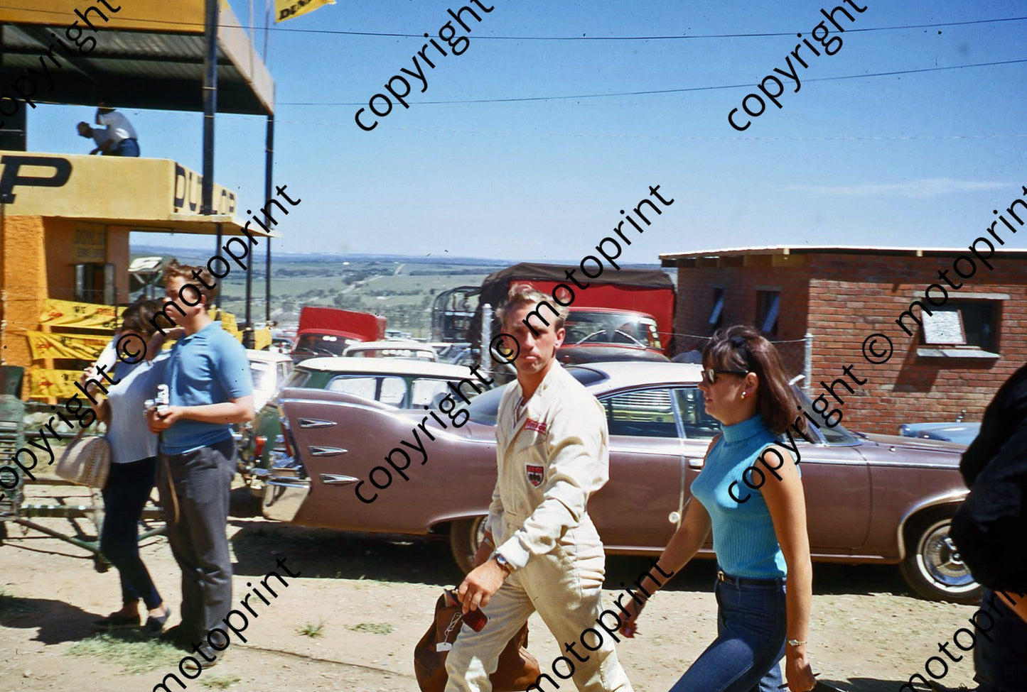 1967 SA GP Mike Spence and wife note car in background (thanks Vito Momo via G Cavalieri) 026