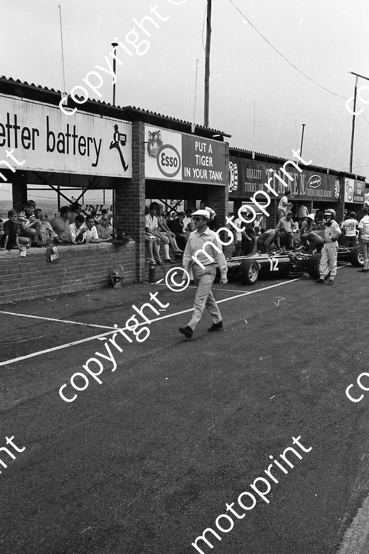 1968 SA GP Colin Chapman, Mike Spence alongside BRM H16 light scratches on print(courtesy Ken Stewart) 036