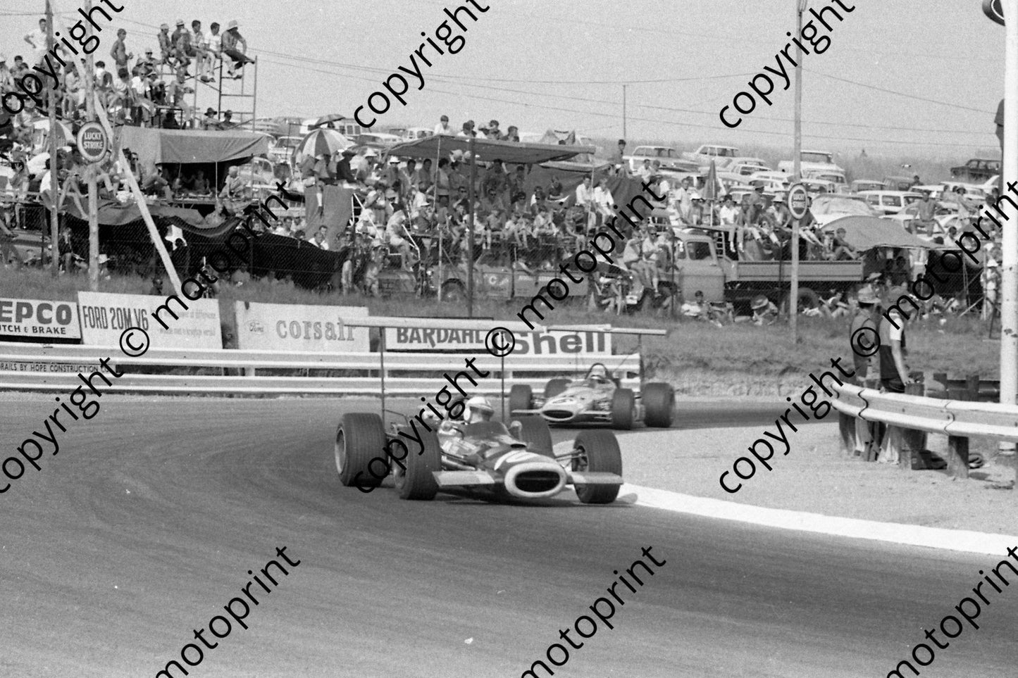 1969 SA GP John Surtees BRM_ Bruce McLaren M7 not pin sharp (courtesy Ken Stewart) 173