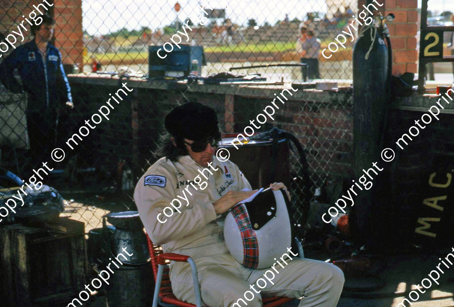 1970 SA GP Jackie Stewart preparing helmet pits (thanks Vito Momo via G Cavalieri) 037