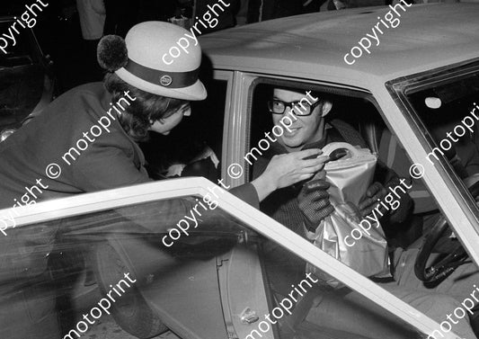 1971 BNU TAP rep handing out food parcel - airline food perhaps K500G (courtesy Roger Swan) (27)