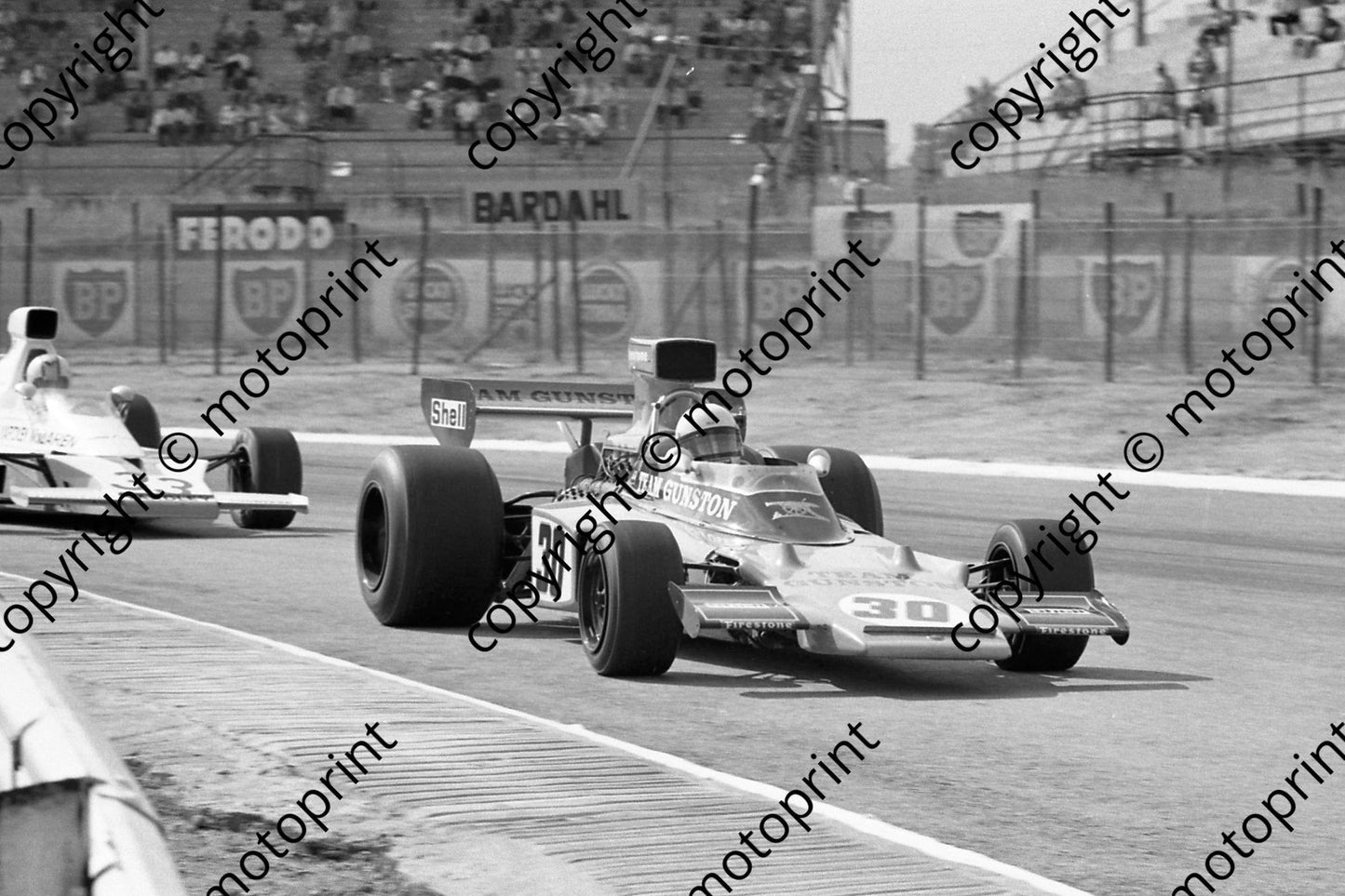 1974 SA GP SS 30 Paddy Driver Lotus 72-R7 in front of his mate Hailwood McLaren M23(permission Malcolm Sampson Motorsport Photography)  (328)