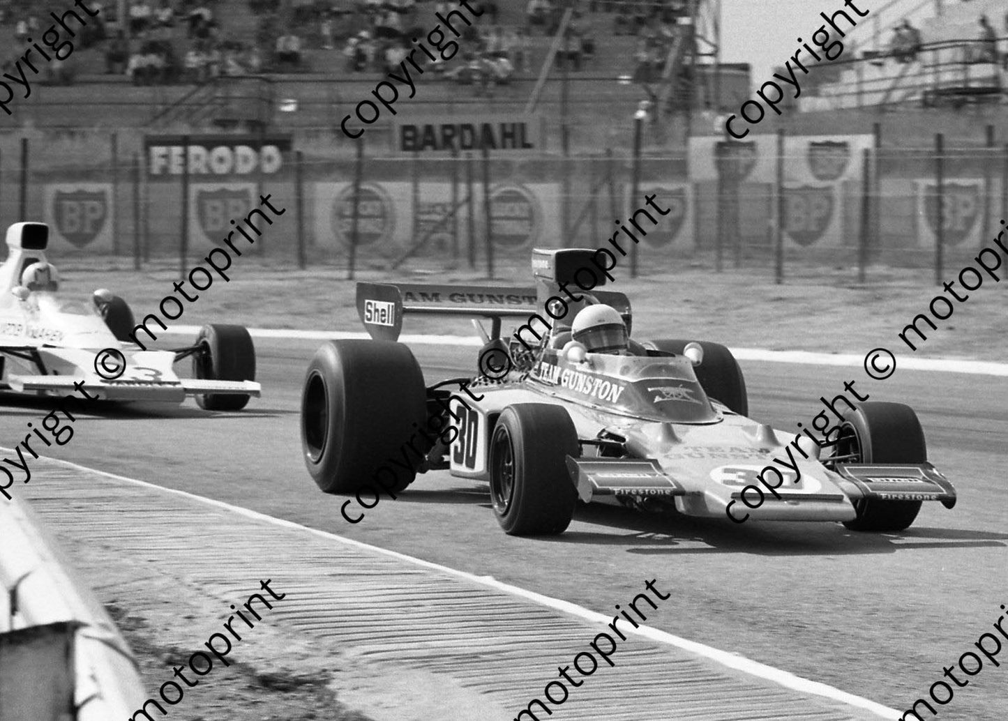 1974 SA GP SS 30 Paddy Driver Lotus 72-R7 in front of his mate Hailwood McLaren M23cleaned 5x7(permission Malcolm Sampson Motorsport Photography)  (328)