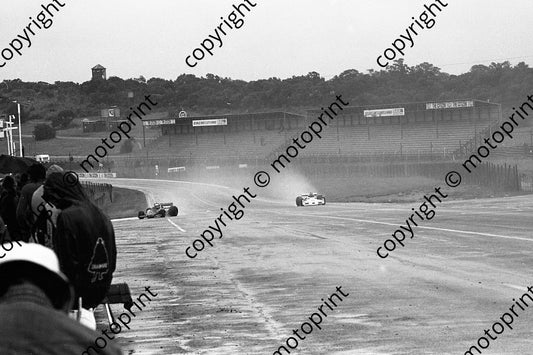 1977 SA GP 19 Vittorio Brambilla Surtees TS19, 20 Jody Scheckter Wolf into pits rain prac