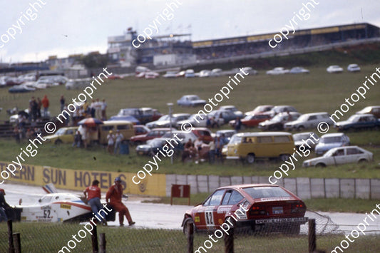 1983 Castrol 1000 82 rain Arnold Chatz Eric Sanders Alfa GTV6 pulls away with catch fence 52 off Bianco Carello (courtesy Roger Swan)