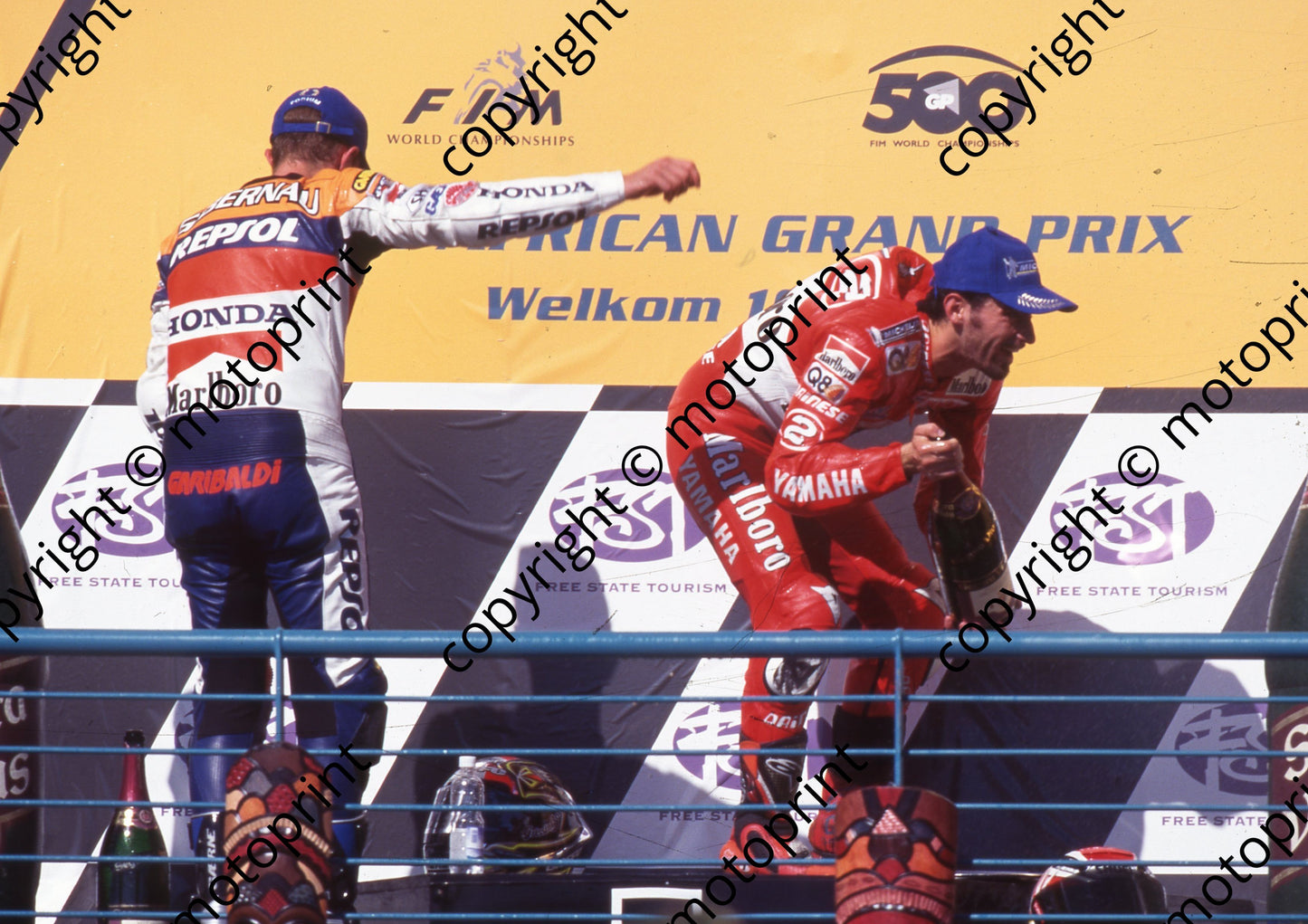 1999 Phakisa SA GP 500 podium Max Biaggi 1st bending, Sete Gibernau 2nd (Watling Photographic) (1)