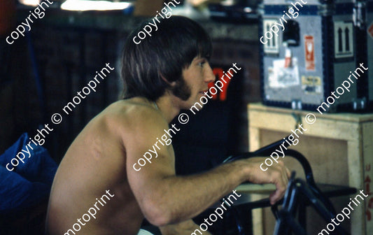 P Haslam portrait bare top