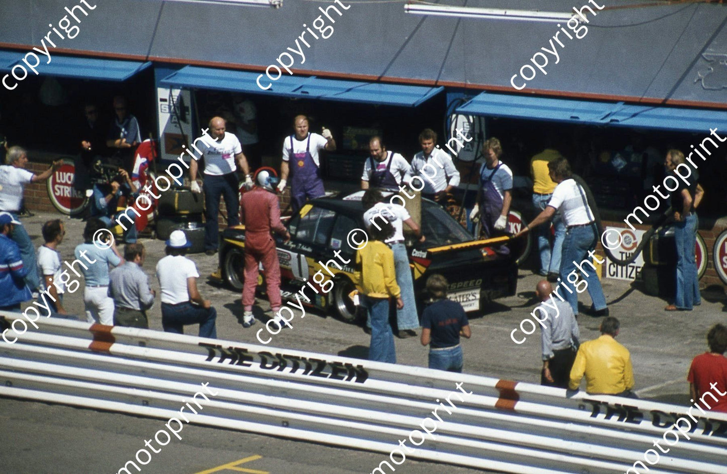 SL (thanks to Stuart Falconer) a 590 1977 Wynns 1000 Escort J Scheckter pitting Heyer next to car