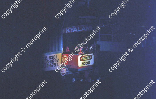 SL (thanks to Stuart Falconer) a 600 1977 Wynns 1000 rostrum Heyer red overalls J Scheckter blue jersey and cap