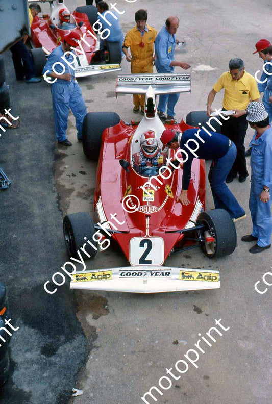SS 2 Regazzoni and Lauda in pits with 312T2s