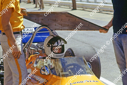 SS Denny Hulme McLaren M19 shaded by pit board scanned A4 20x30 006