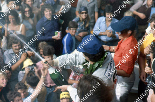 SS Scheckter on podium sprays crowd