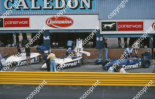 SS (thanks Stuart Falconer) a 796 1982 SA GP Tyrrell 011 pits #3 white and blue cars Alboreto_ #4 white Borgudd